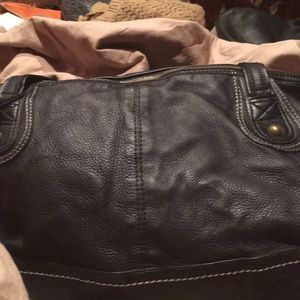 The SAK black leather bag with white stitching